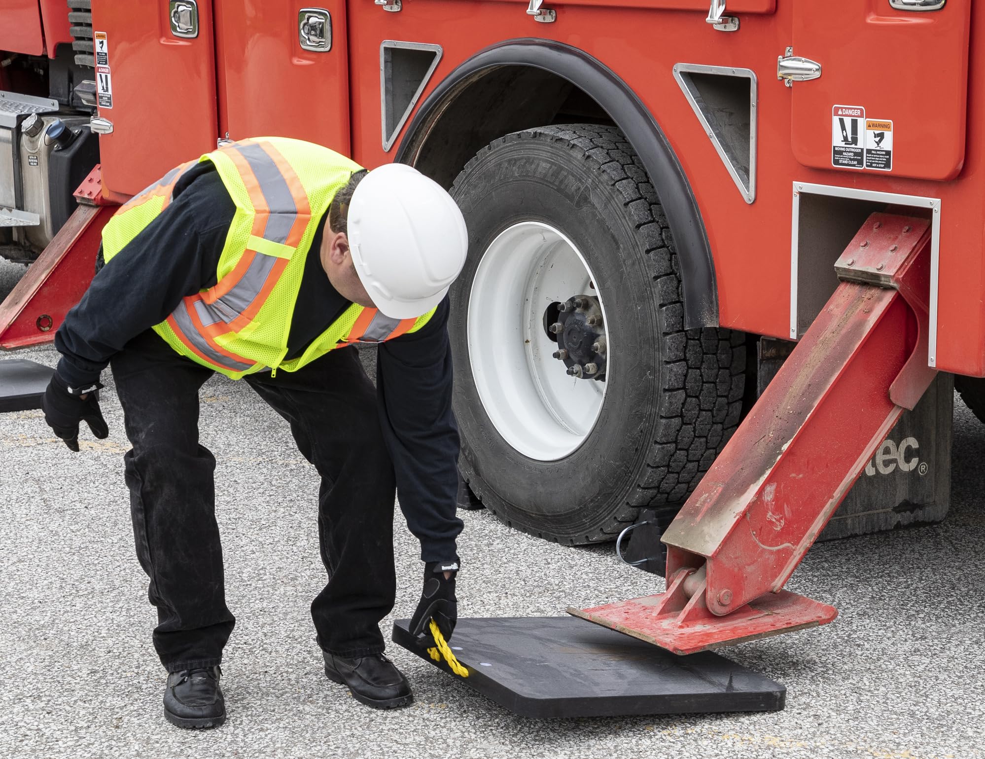 Buyers Products pad under truck jack demonstrating improved stability