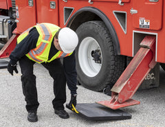 Buyers Products pad under truck jack demonstrating improved stability