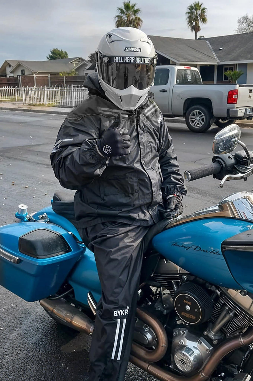 BYKR rider wearing suit in rain illustrating real-world wet weather use