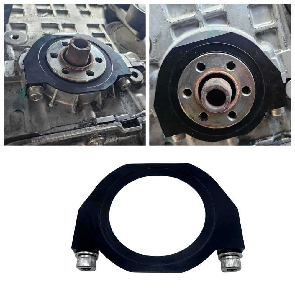 BZP guard installed in BMW engine bay protecting crank seal and belt from debris