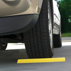 Camco AccuPark installed under a single tire showing precise stopping point and space protection