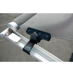 Camco De-Flapper Max clamped on RV awning in wind, reduces noisy flapping