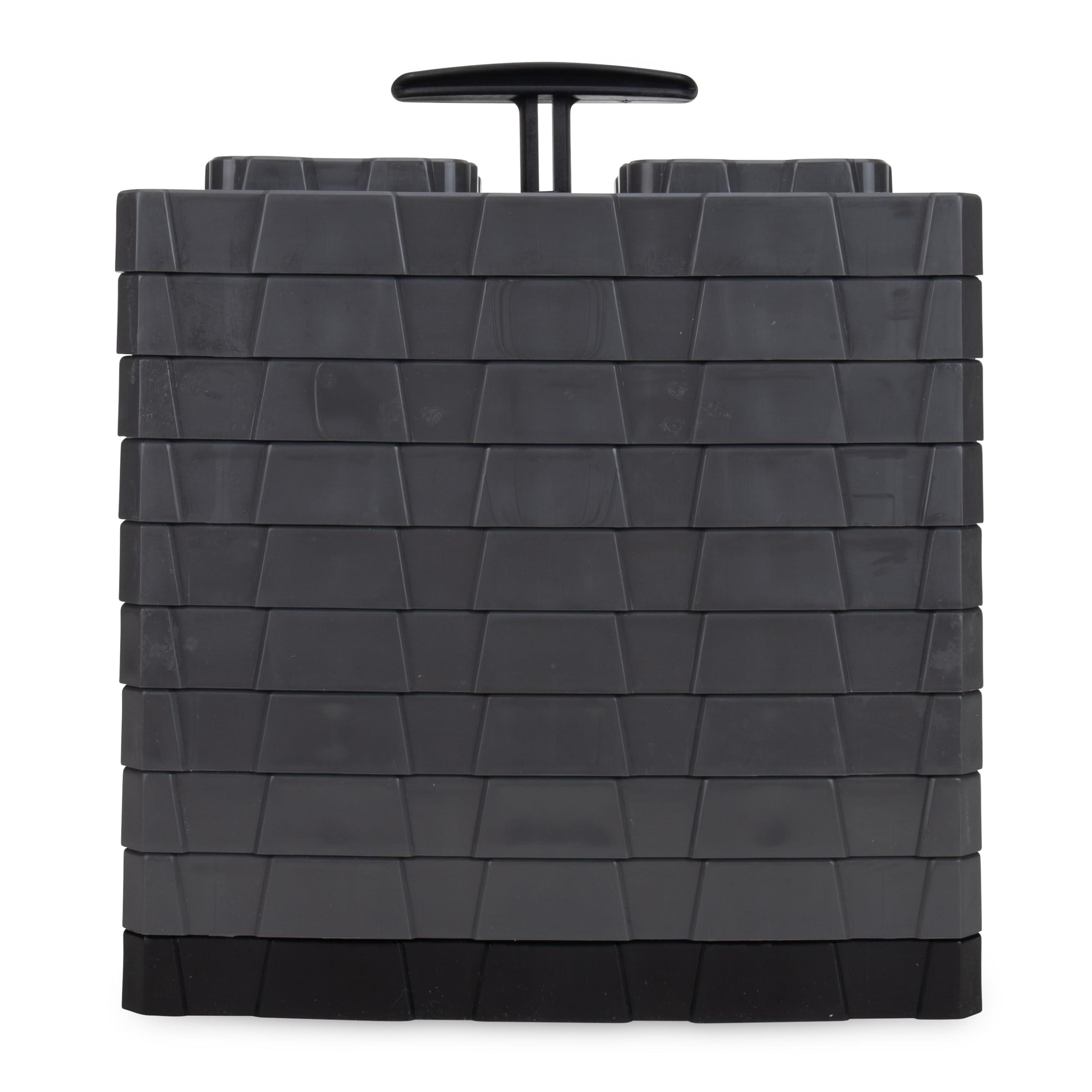 Camco FasTen XL stacked under an RV wheel providing secure stabilization on uneven ground