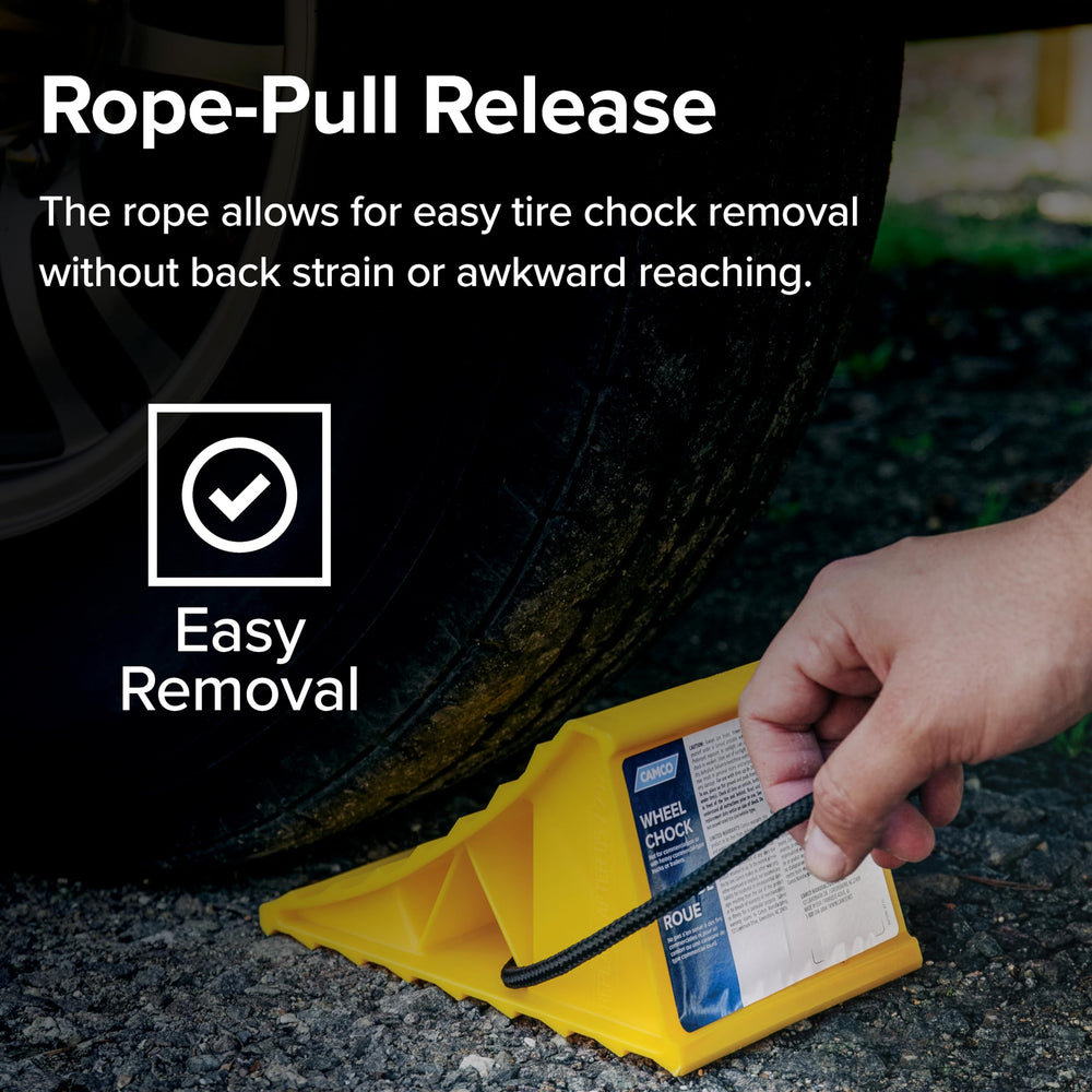 Camco in use pressed against RV tire demonstrating strong wheel hold