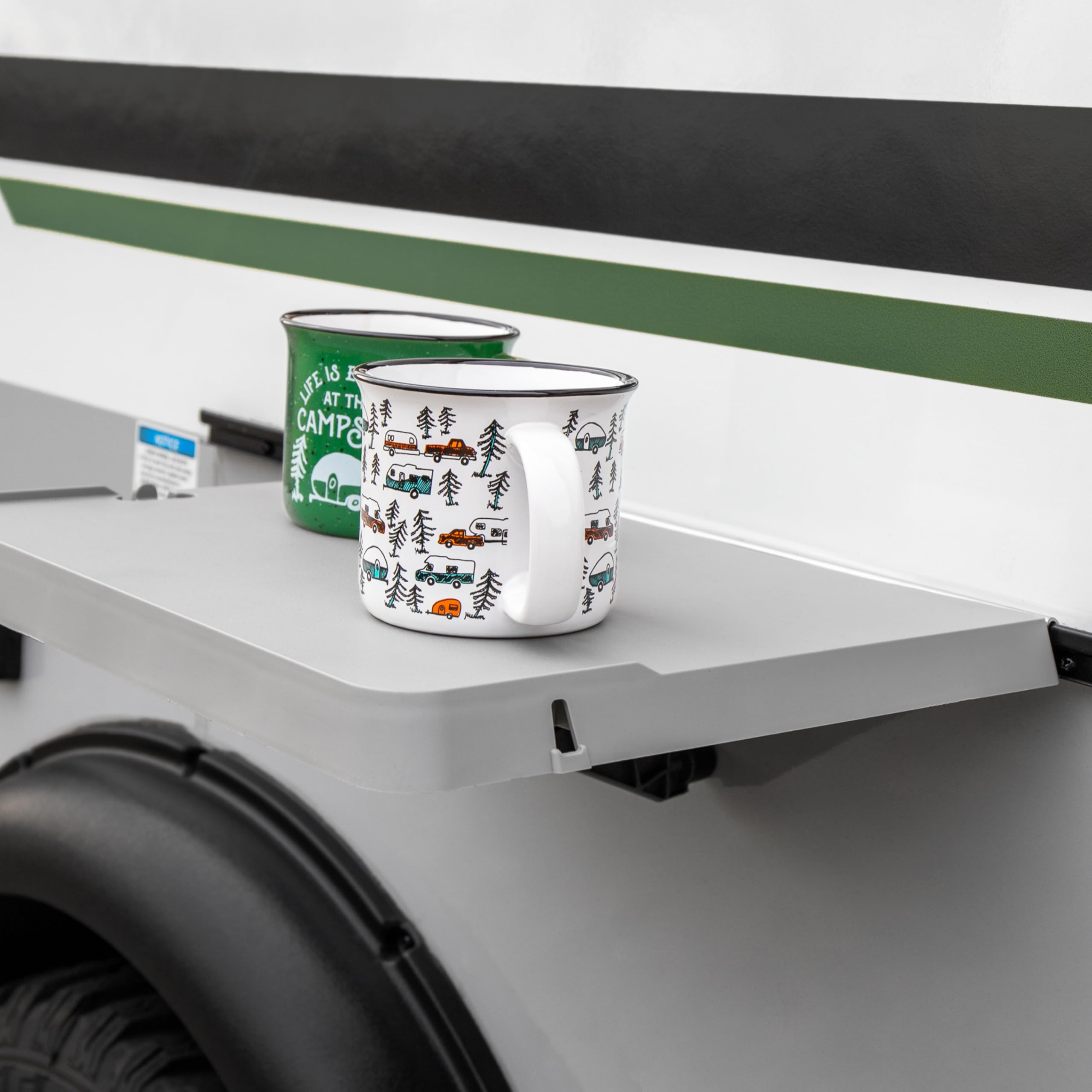 Camco table attached to RV rail demonstrating quick mount and space-saving benefit