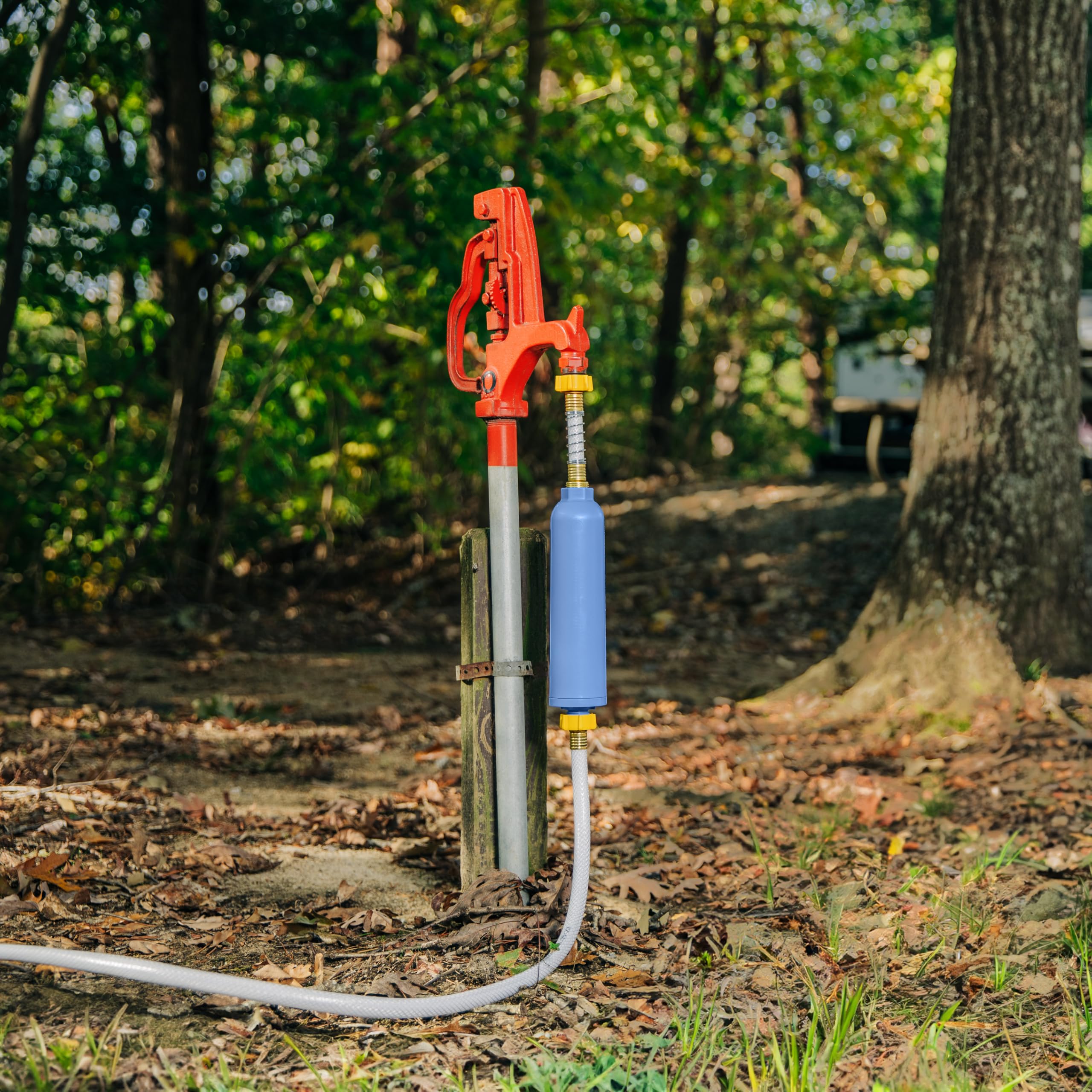 Camco TastePURE alongside tape measure showing 75-foot reach benefit