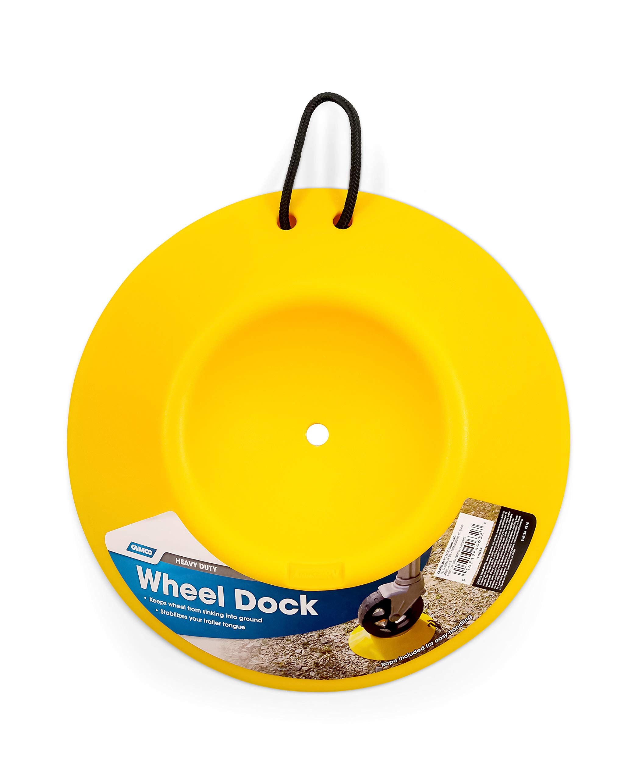 Camco wheeldock placed under trailer wheel preventing sinking on soft ground