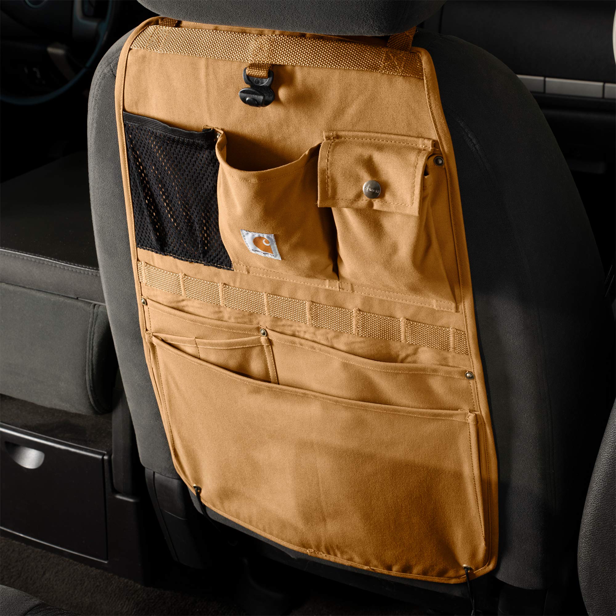 Carhartt lifestyle shot in truck interior keeping tools and family items reachable benefit