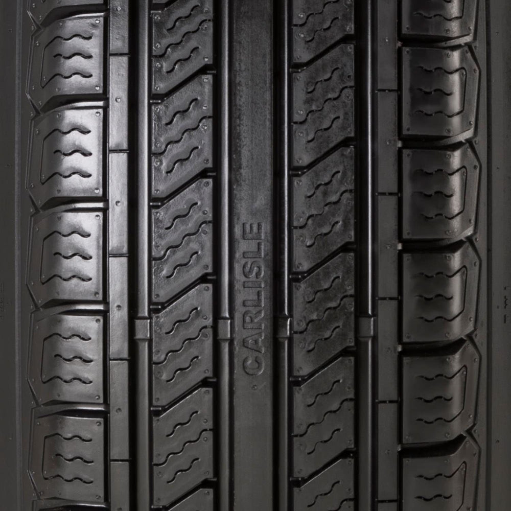 Carlisle Radial Trail HD next to ruler showing scale for accurate size confirmation