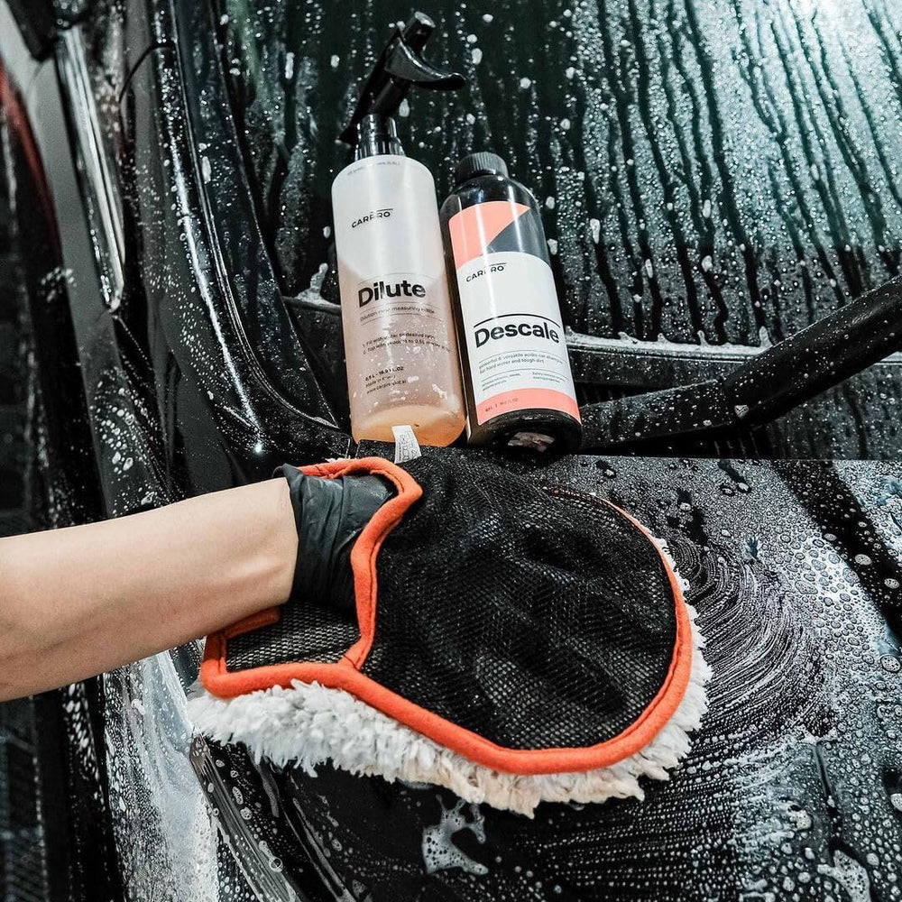 CARPRO Descale suds on vehicle paint showing safe decontamination action