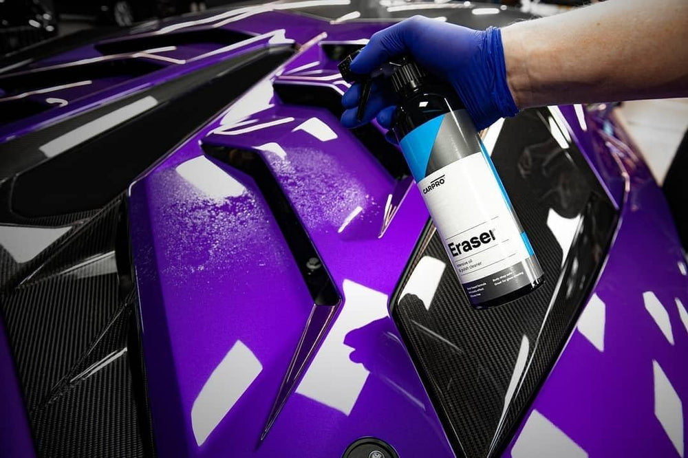 CARPRO Eraser cleaning tire sidewall to remove oils and improve appearance