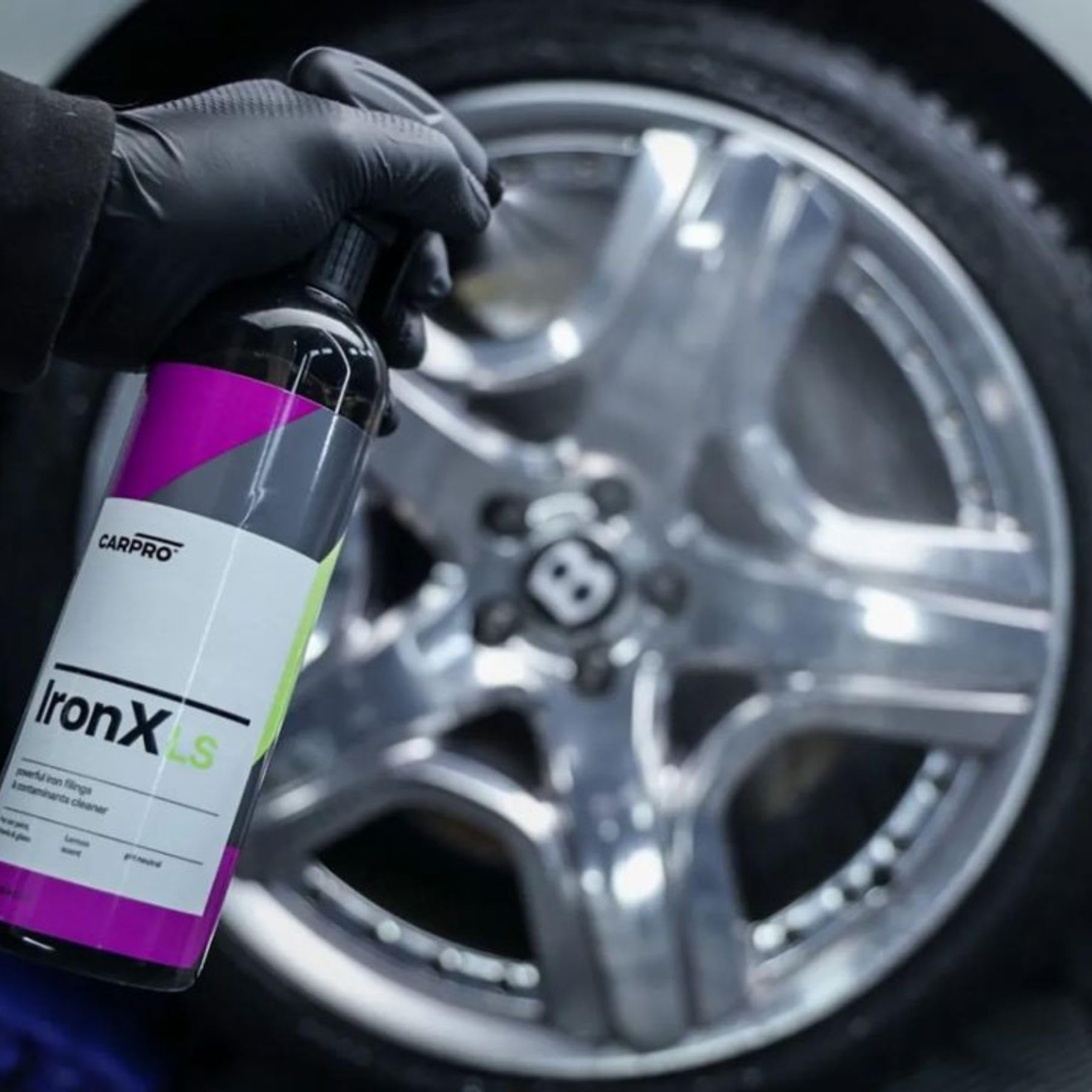 CARPRO sprayed on wheel showing breakdown of brake dust and easier cleaning benefit