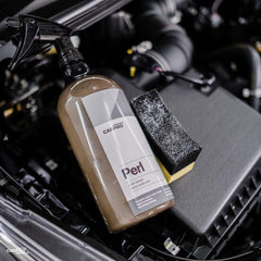 CARPRO PERL being sprayed on dashboard demonstrating easy interior application and finish
