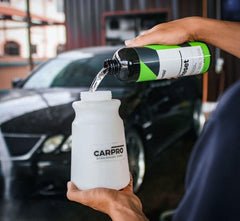 CARPRO Reset being applied with wash mitt showing smooth glide and reduced risk of swirls