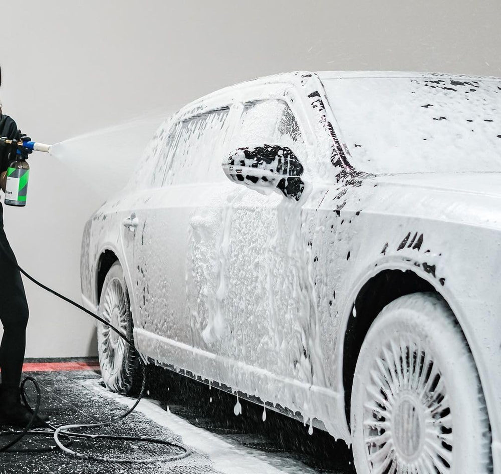 CARPRO Reset used on coated panel beside untreated panel showing gentle cleaning benefit