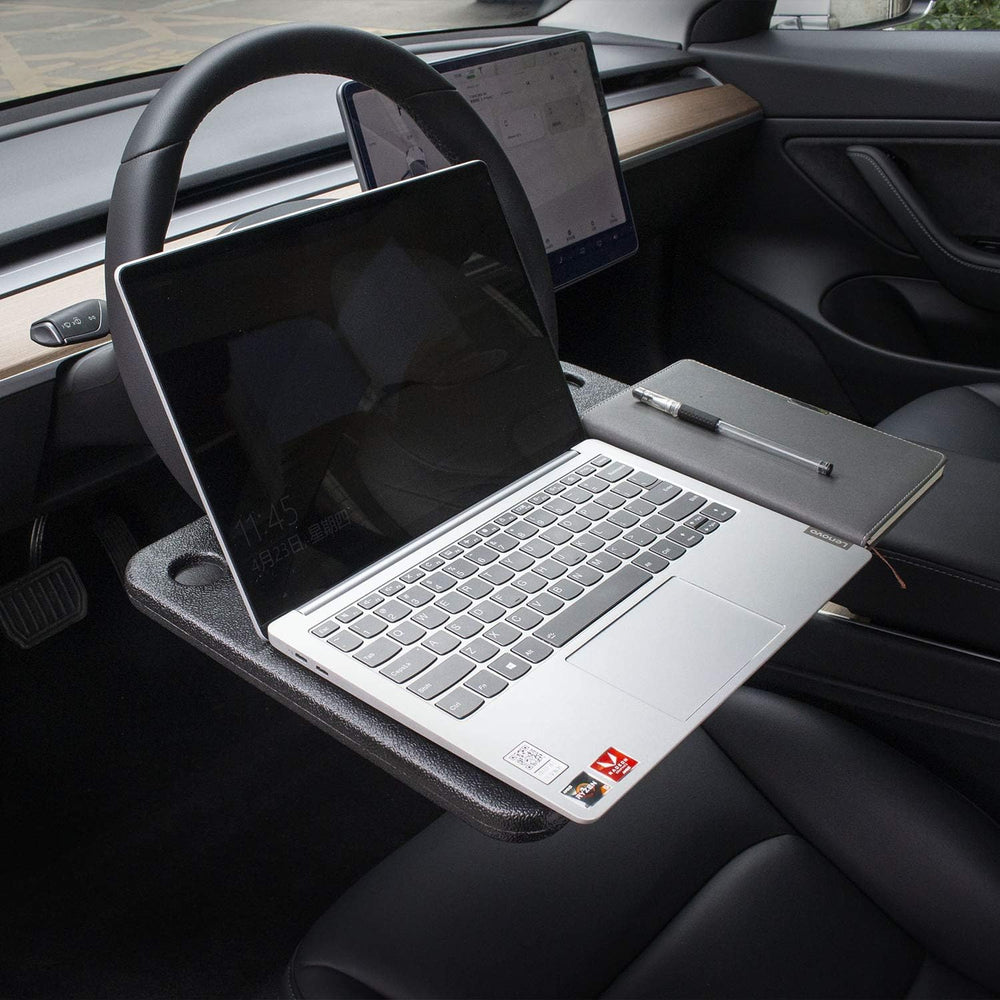 CarQiWireless flat side supporting a laptop for quick mobile productivity