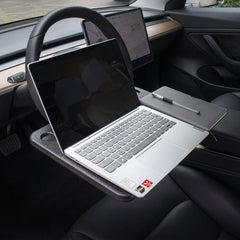 CarQiWireless flat side supporting a laptop for quick mobile productivity