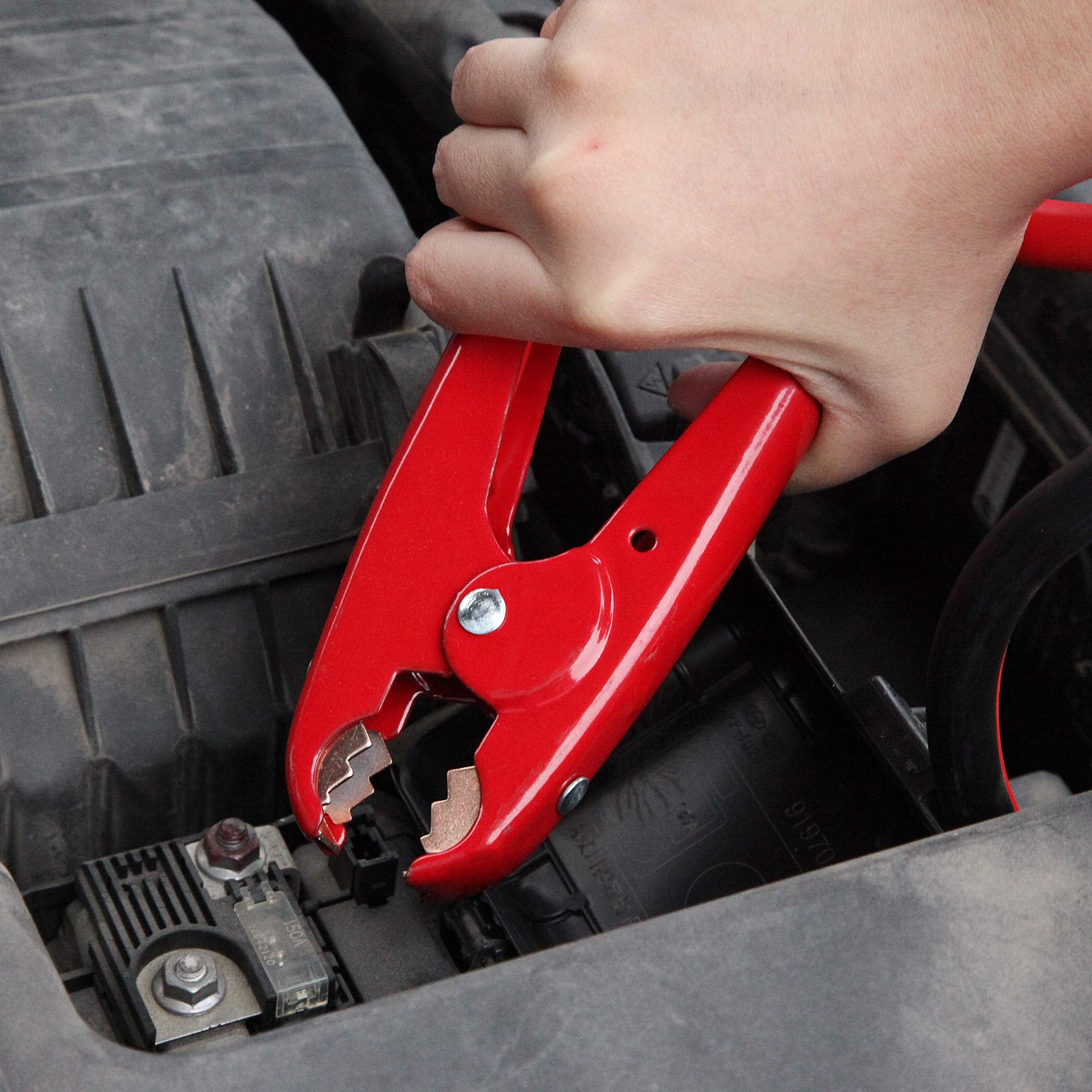 CARTMAN cables connected to a pickup during a jump-start illustrating reliable power transfer