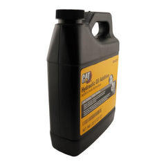 CAT additive being poured into a hydraulic reservoir, demonstrating correct application