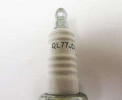 Champion spark plug installed in an outboard engine demonstrating correct application