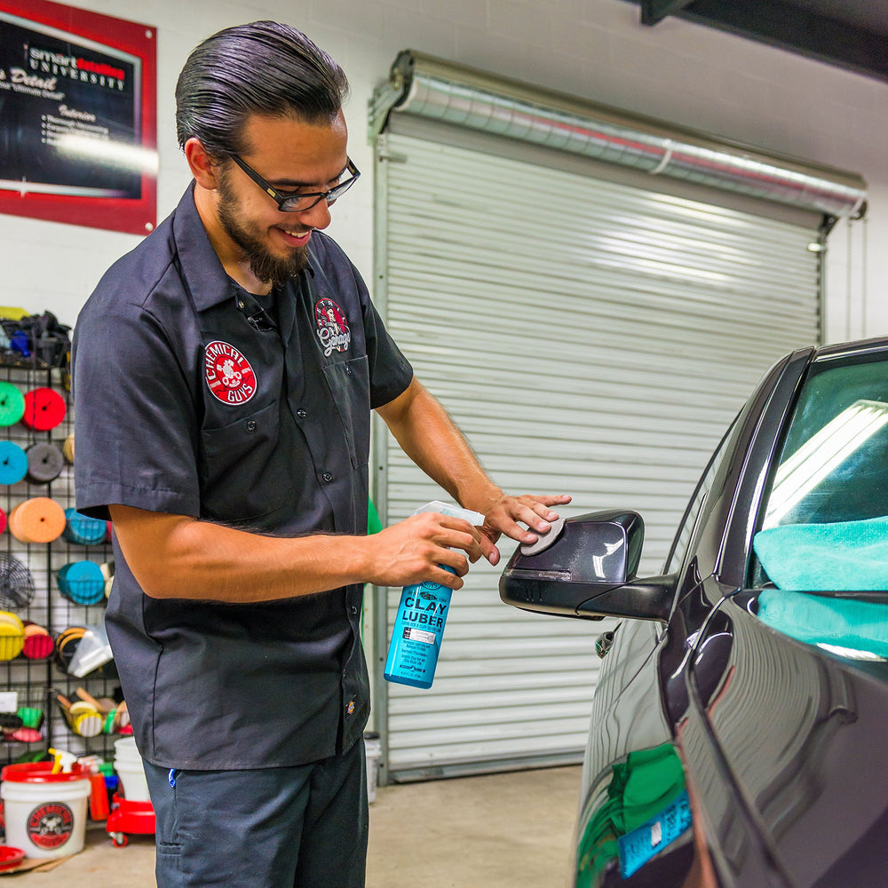 Chemical Guys kit staged in trunk for detailing-ready convenience