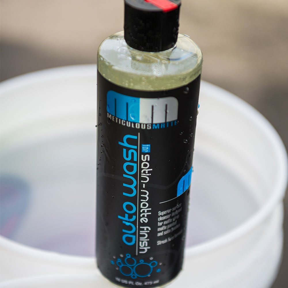 Chemical Guys being measured and poured with dilution marks for control