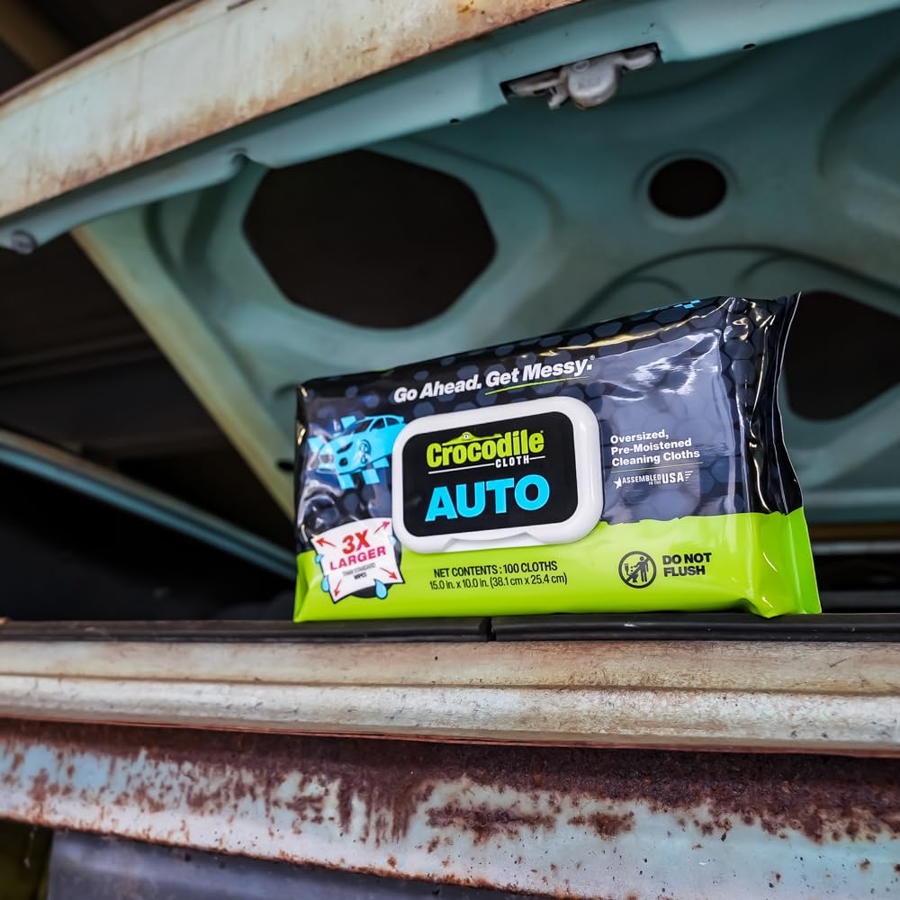 Crocodile Cloth wipes in garage setting used by mechanic, efficiency benefit