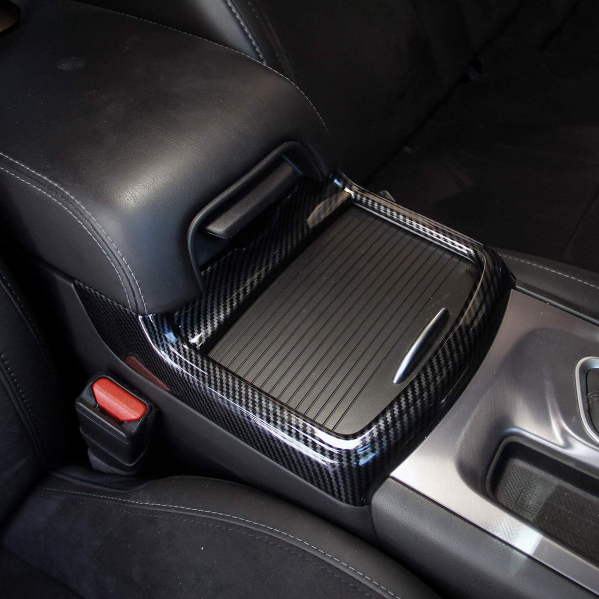 crosselec front view of red carbon fiber cup holder trim, adds sporty contrast