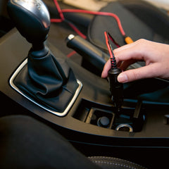 CTEK CIG Plug inserted in vehicle 12V socket demonstrating easy charging