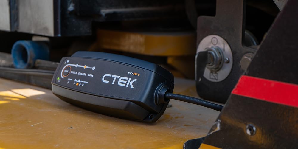 CTEK NXT 5 next to a hand for size comparison emphasizing compact, portable benefit