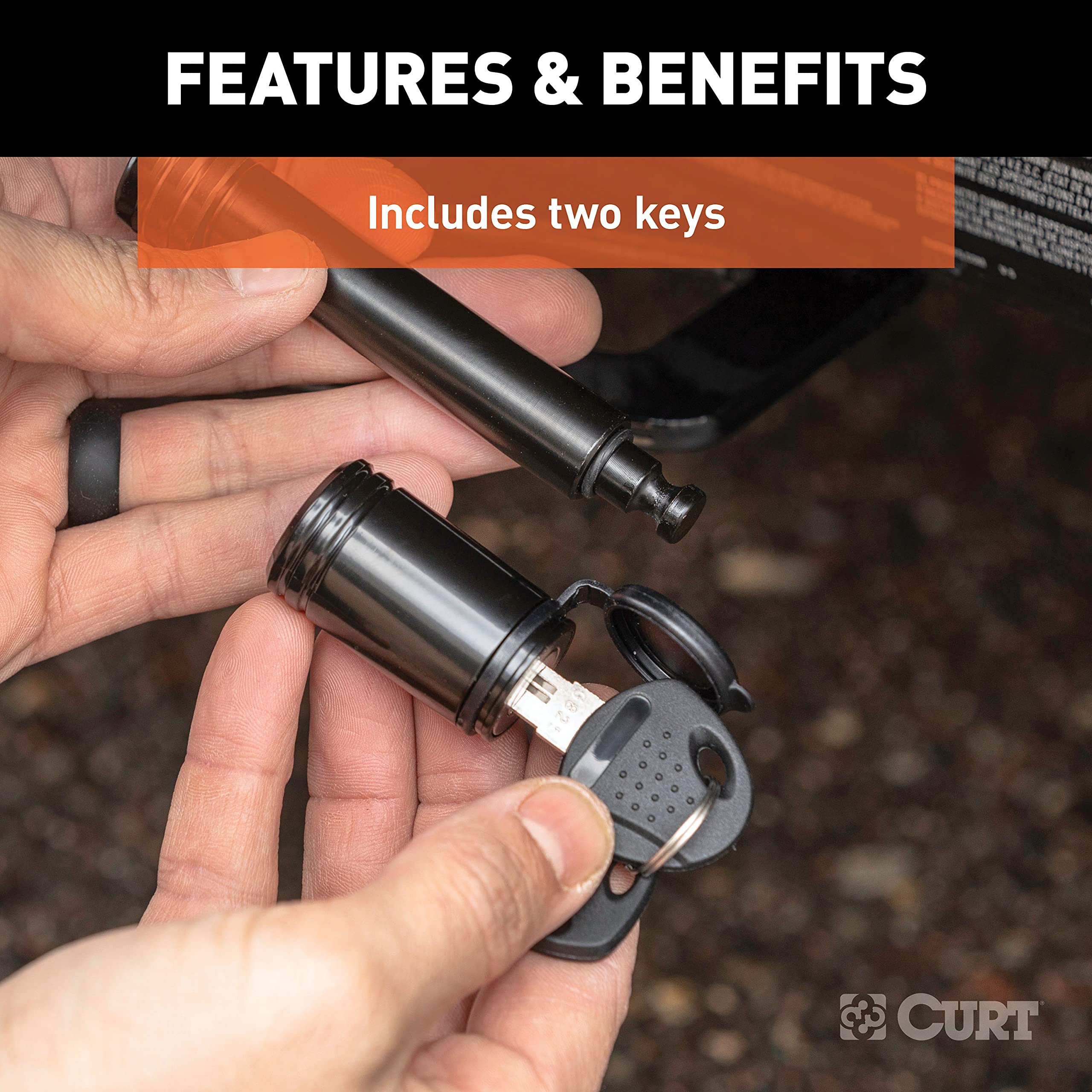 CURT lifestyle image on truck hitch illustrating protection for trailer gear