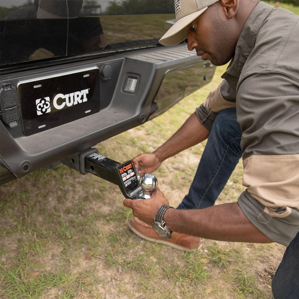 CURT class 4 ball mount towing a trailer showing real-world heavy-duty performance