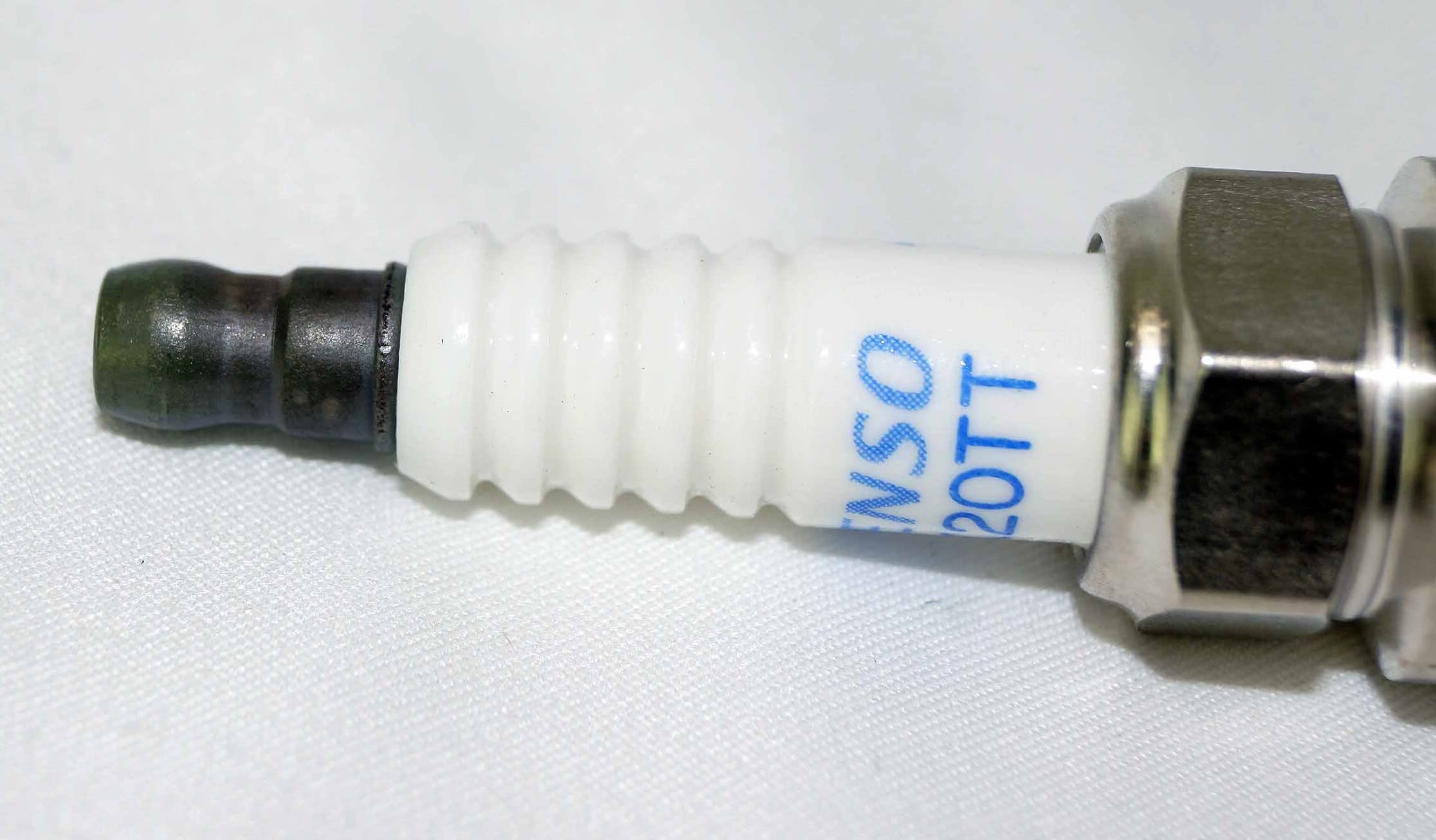 Denso PK20TT installed in an engine illustrating reliable ignition benefit