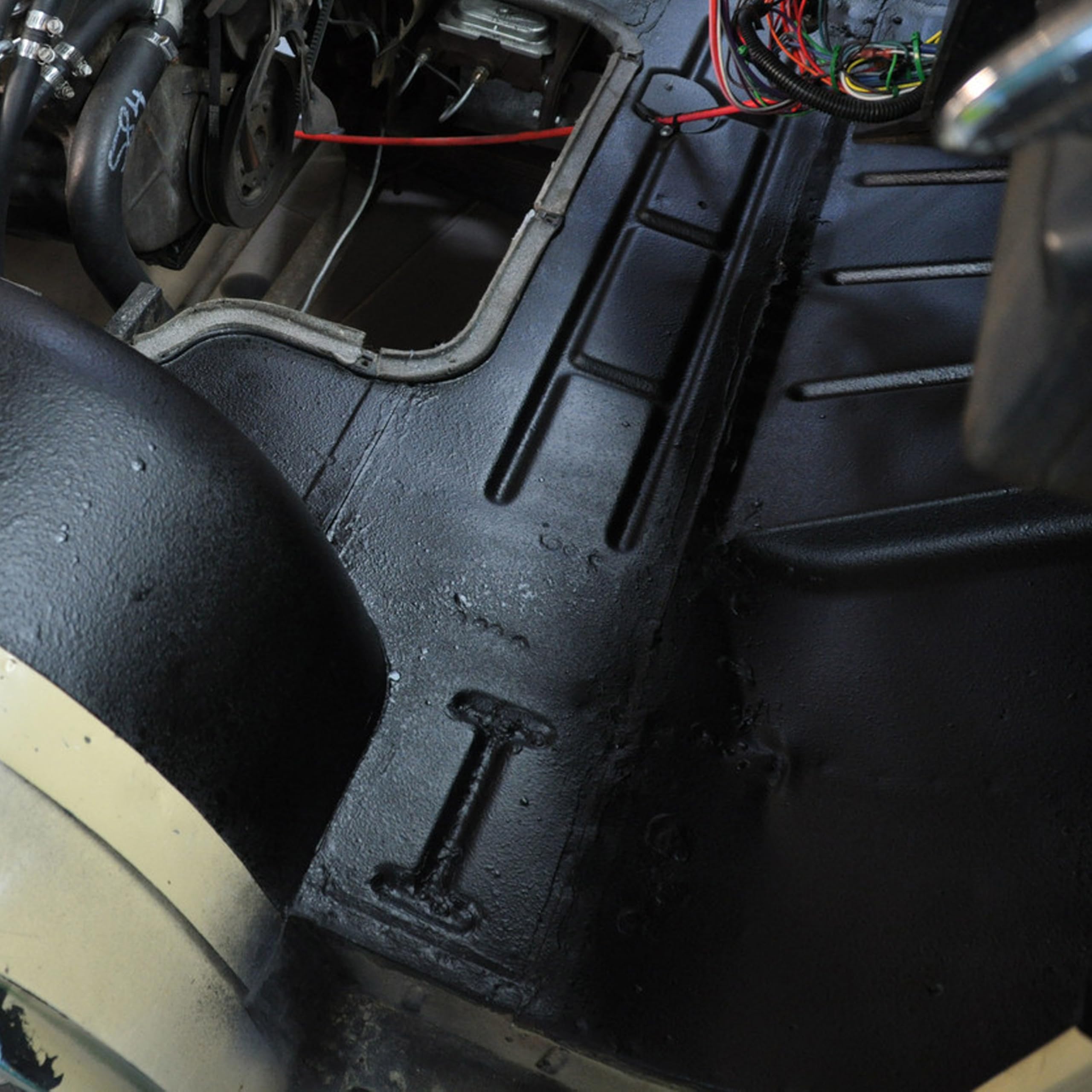 Design Engineering fender well treated with spray showing corrosion resistance benefit