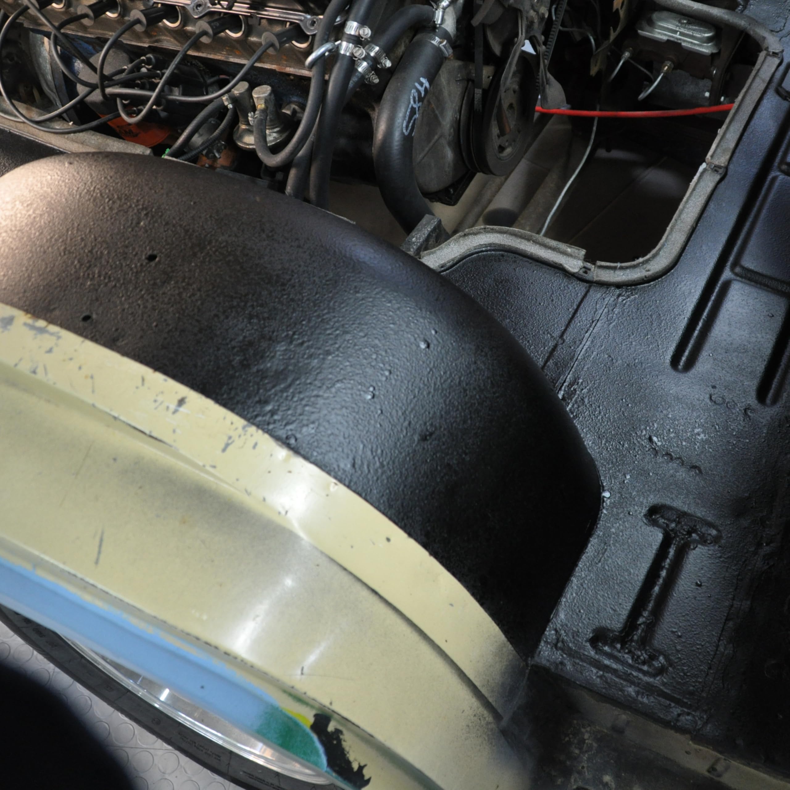 Design Engineering sprayed panel near engine, indicates thermal insulation benefit