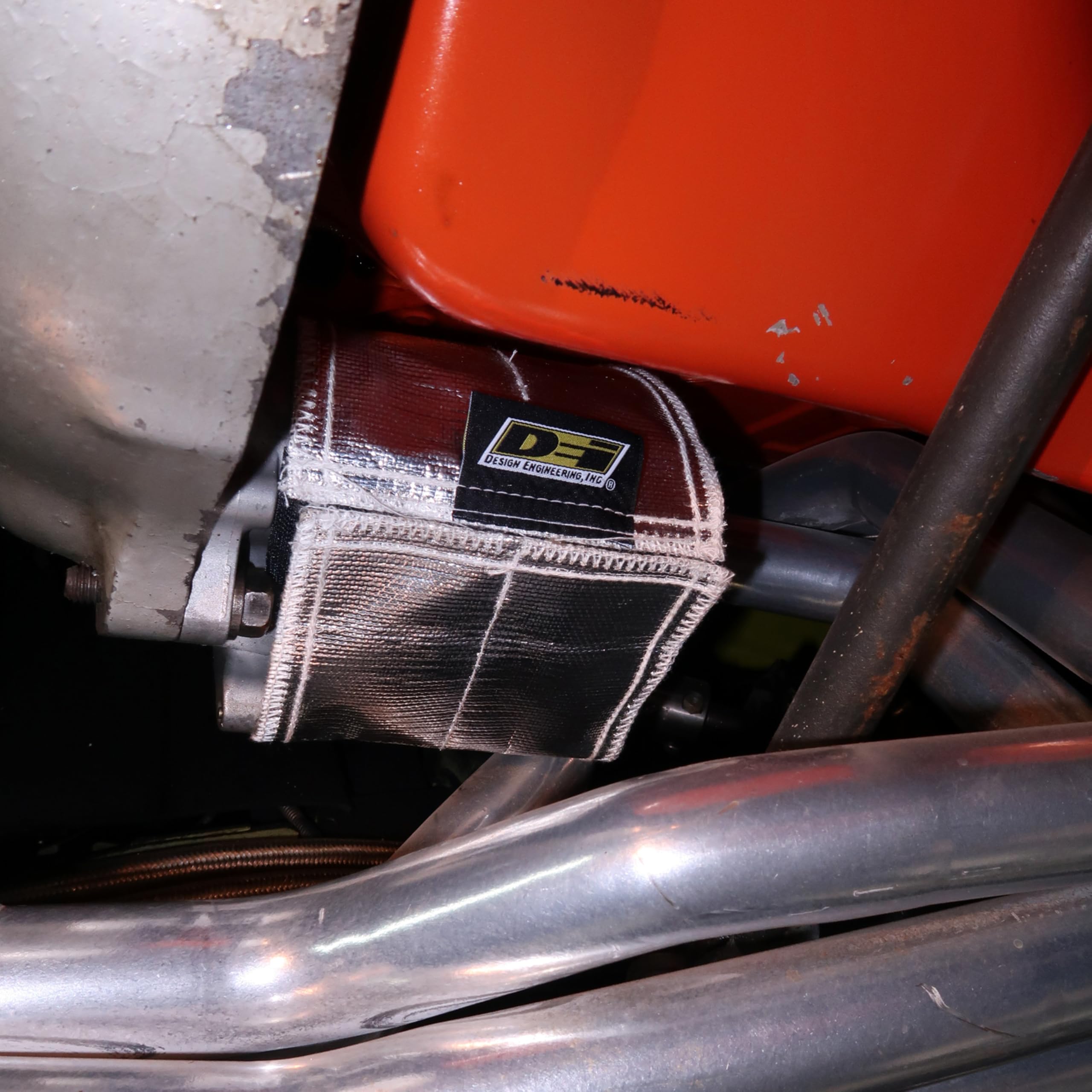 Design Engineering wrap installed under hood protecting nearby components