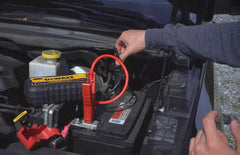 DEWALT heavy-duty metal clamps attached to battery terminals ensuring secure connections