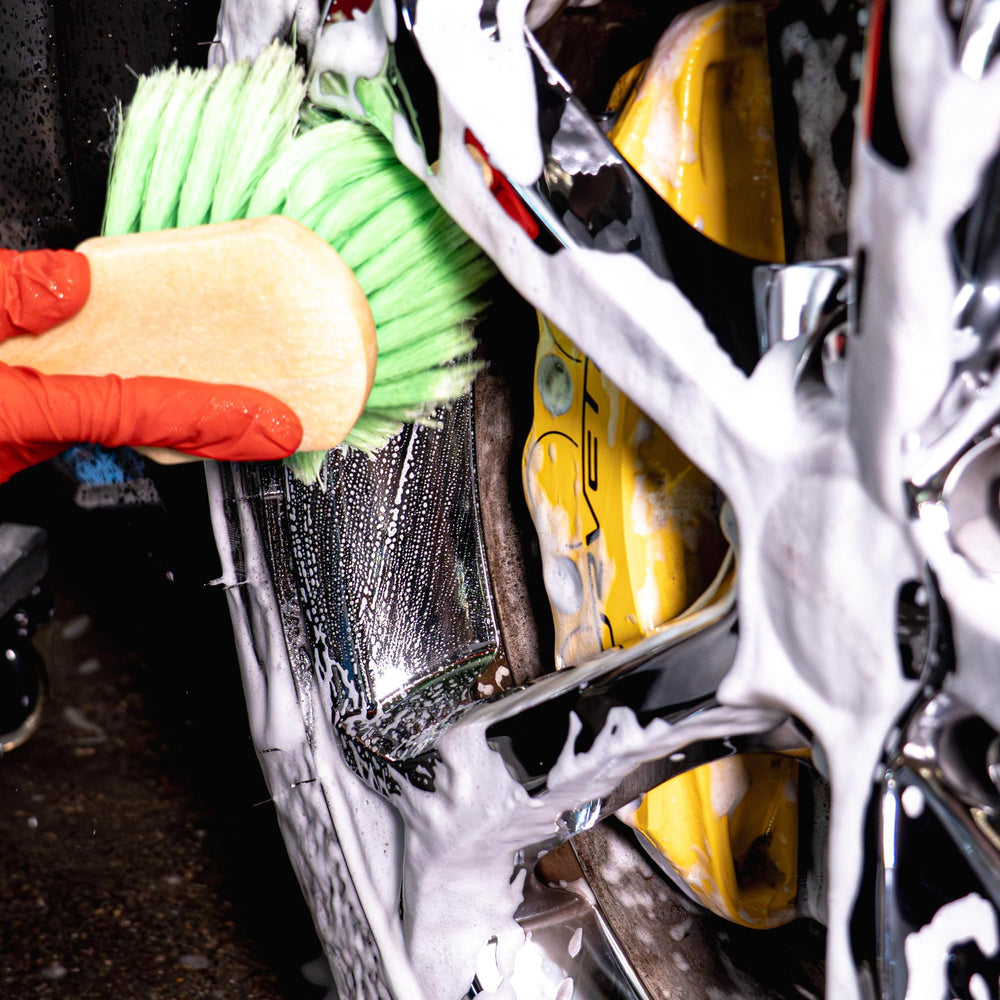 diy detail owner washing car in driveway highlighting user-friendly professional results