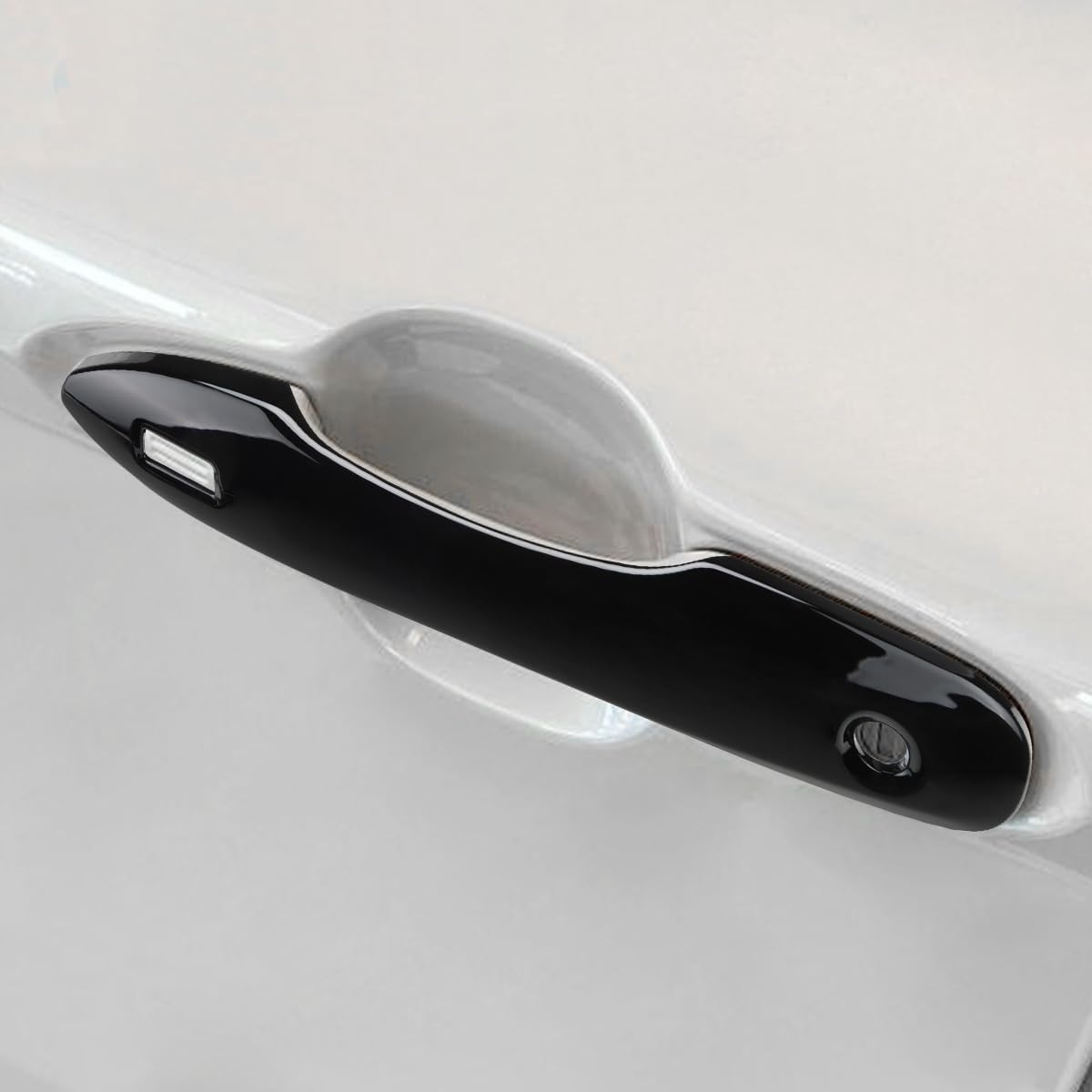DLOVEG handle cover next to key fob for scale showing compact protective trim