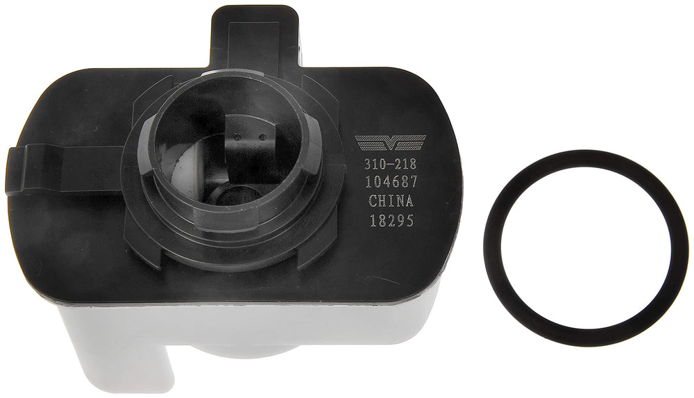 Dorman 310-218 next to ruler showing compact size and simple fitment