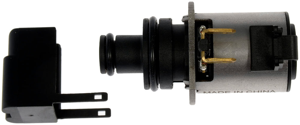 Dorman solenoid next to ruler for accurate size and scale confirmation