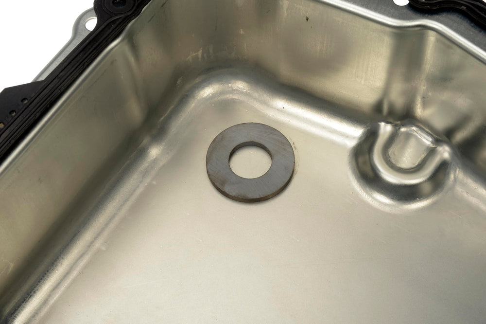 Dorman mounting hole alignment closeup verifying match to factory bolt locations