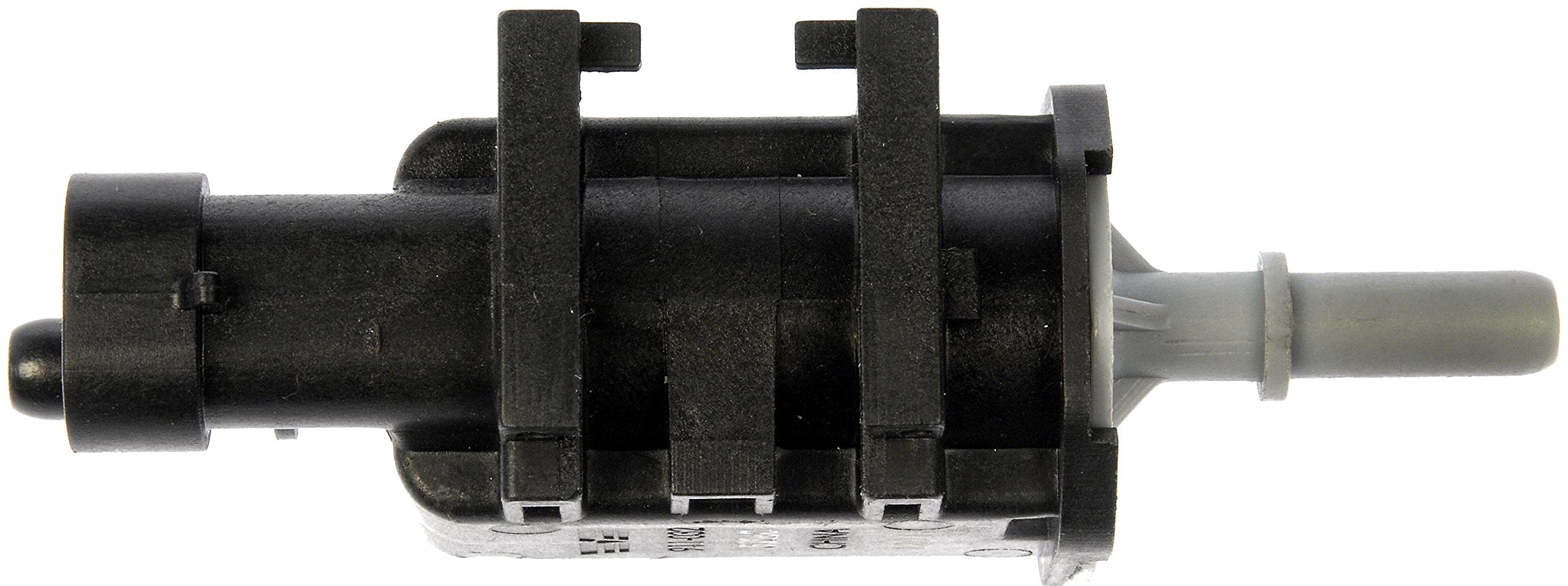 Dorman purge valve beside a coin for scale showing compact direct-fit size