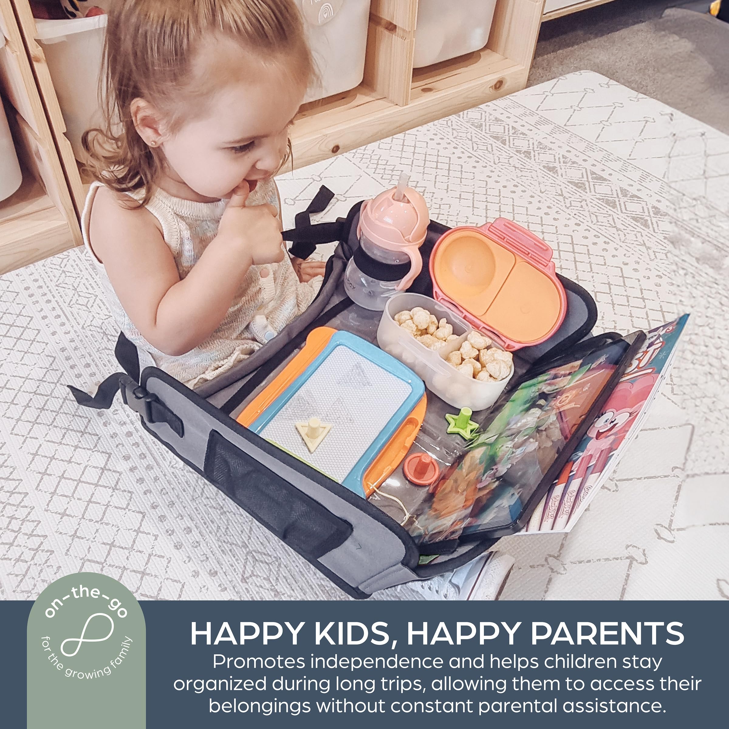 Dreambaby cup holder and six pockets holding snacks and crayons neatly