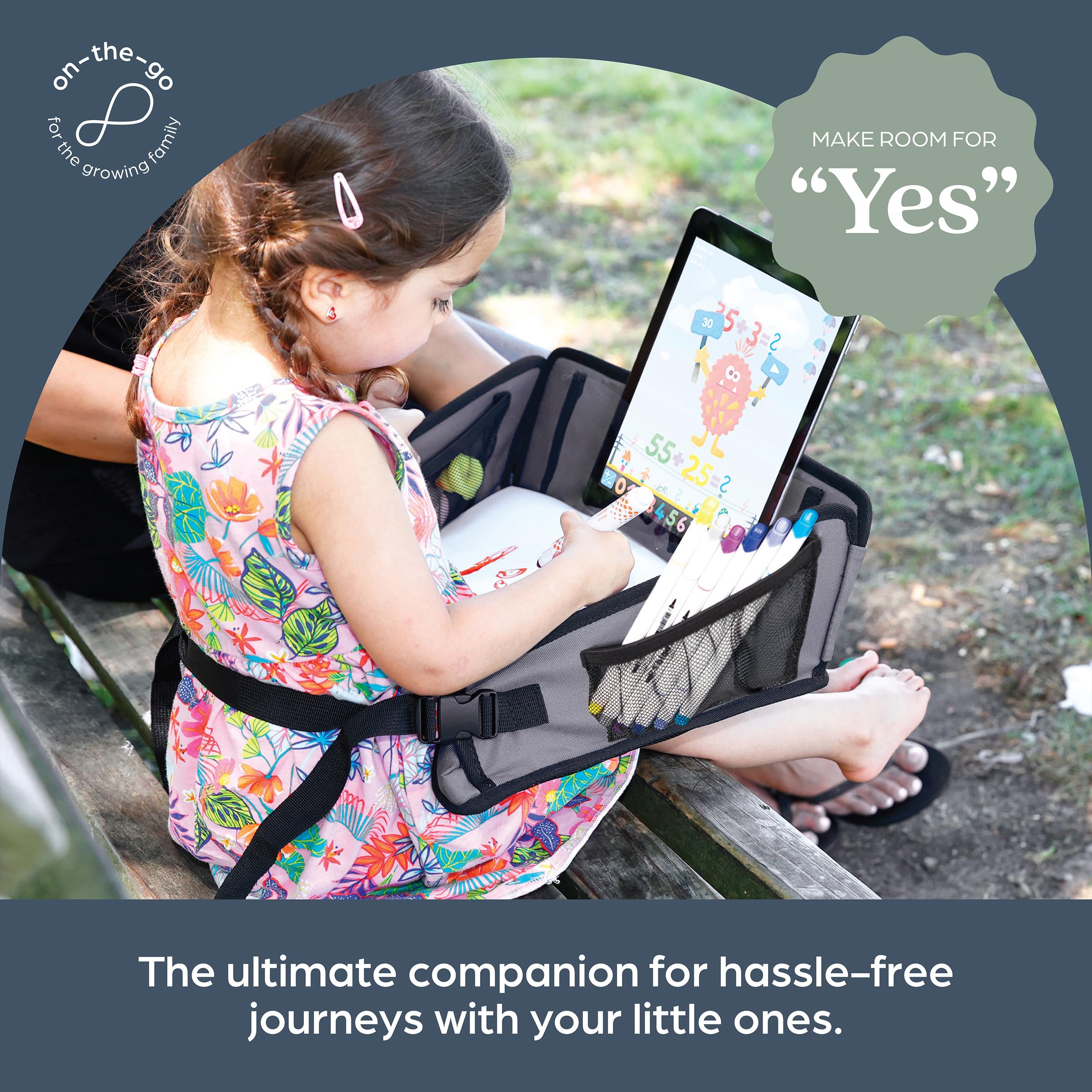 Dreambaby tray on child's lap enabling eating and drawing with independence