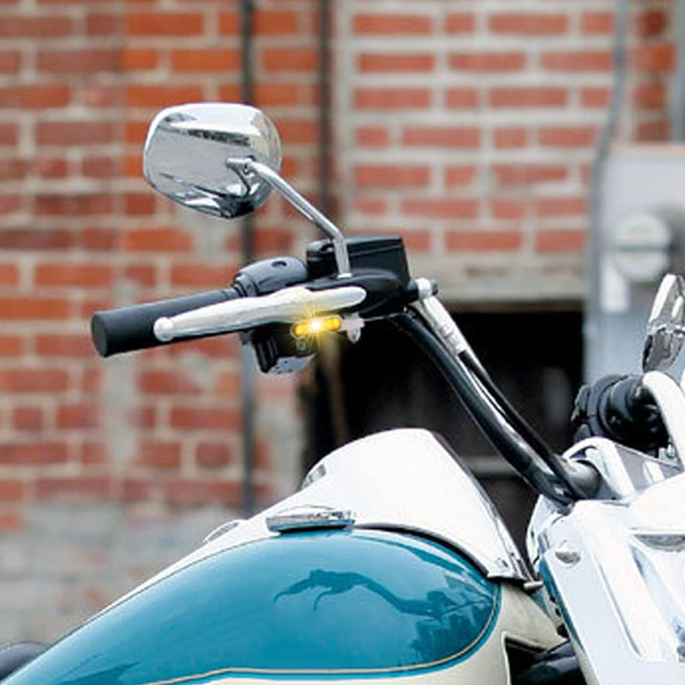 DREAMIZER installed on motorcycle in street setting improving daytime visibility