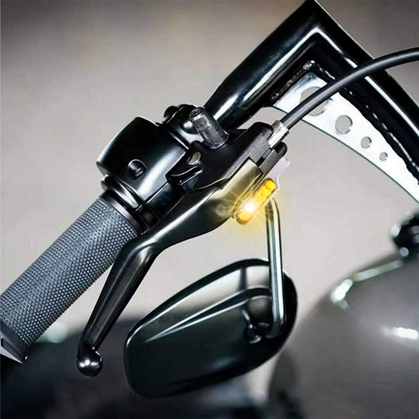 DREAMIZER mounted under handlebar mirror demonstrating discreet installation benefit