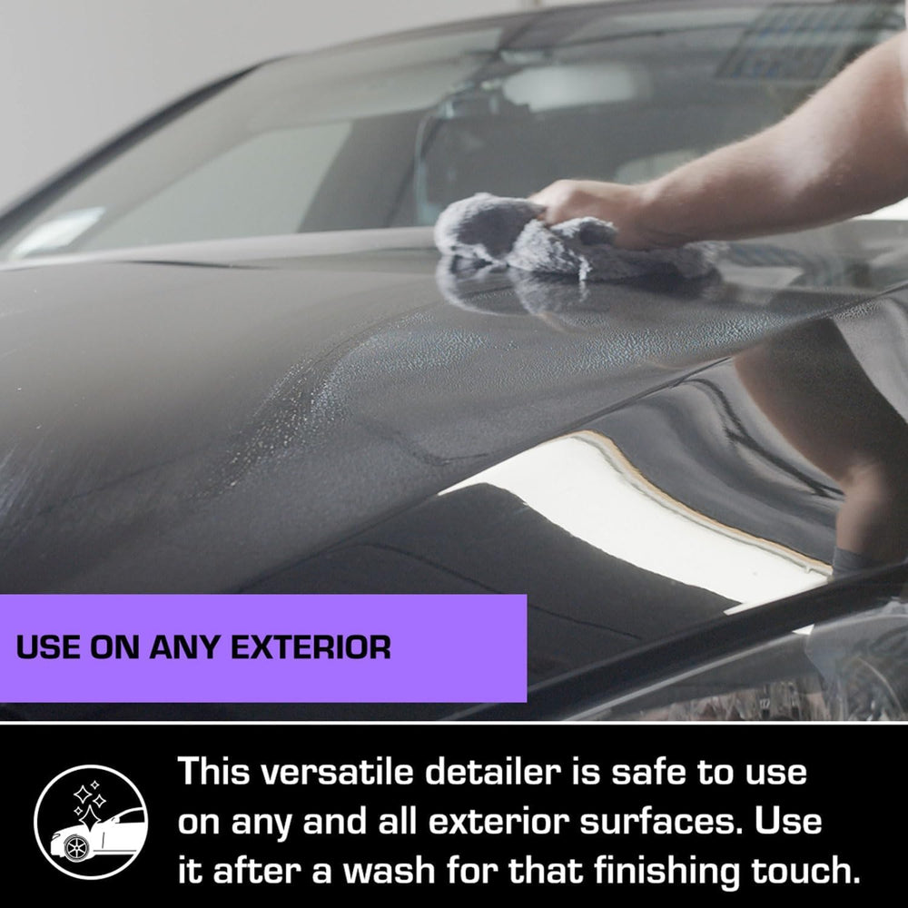 Ethos Handcrafted Car Care on glass being wiped for streak-free clarity