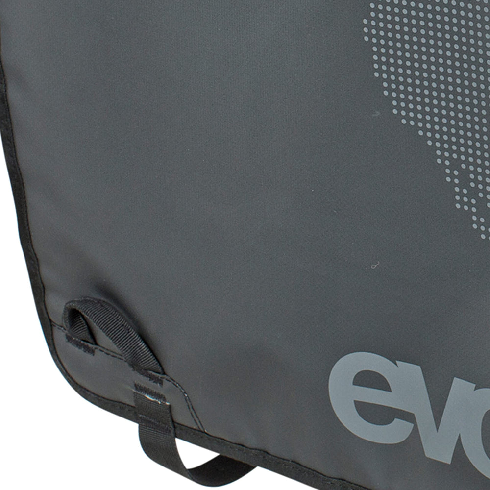 EVOC tailgate pad beside a bike showing scale and fit for typical pickup loading