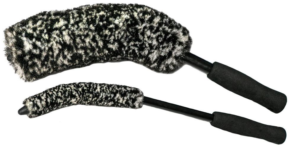 ExoForma brush length compared with hand showing 16-inch reach for behind-spoke access